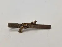 Slipsenåle våben og ammunition