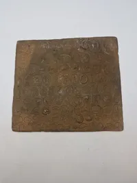 Bronze relief med romerske bordel mønter