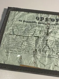 Originalt “Oprop” i ramme, nedkastet over Danmark 9.april 1940. Meget slidt - historie ukendt