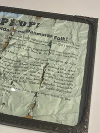 Originalt “Oprop” i ramme, nedkastet over Danmark 9.april 1940. Meget slidt - historie ukendt