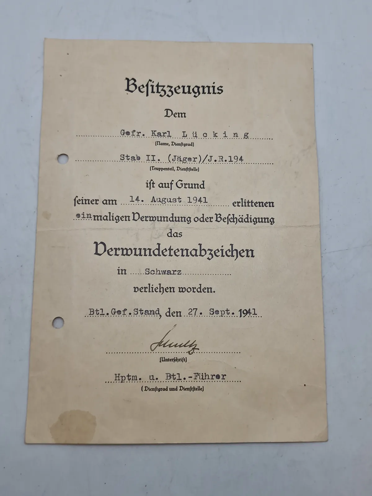 Originalt urkunde - verwundetenabzeichen in schwarz, ww2