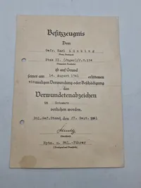 Originalt urkunde - verwundetenabzeichen in schwarz, ww2