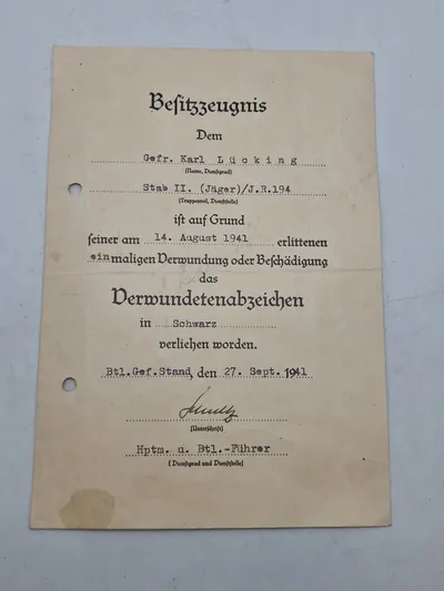 Originalt urkunde - verwundetenabzeichen in schwarz, ww2