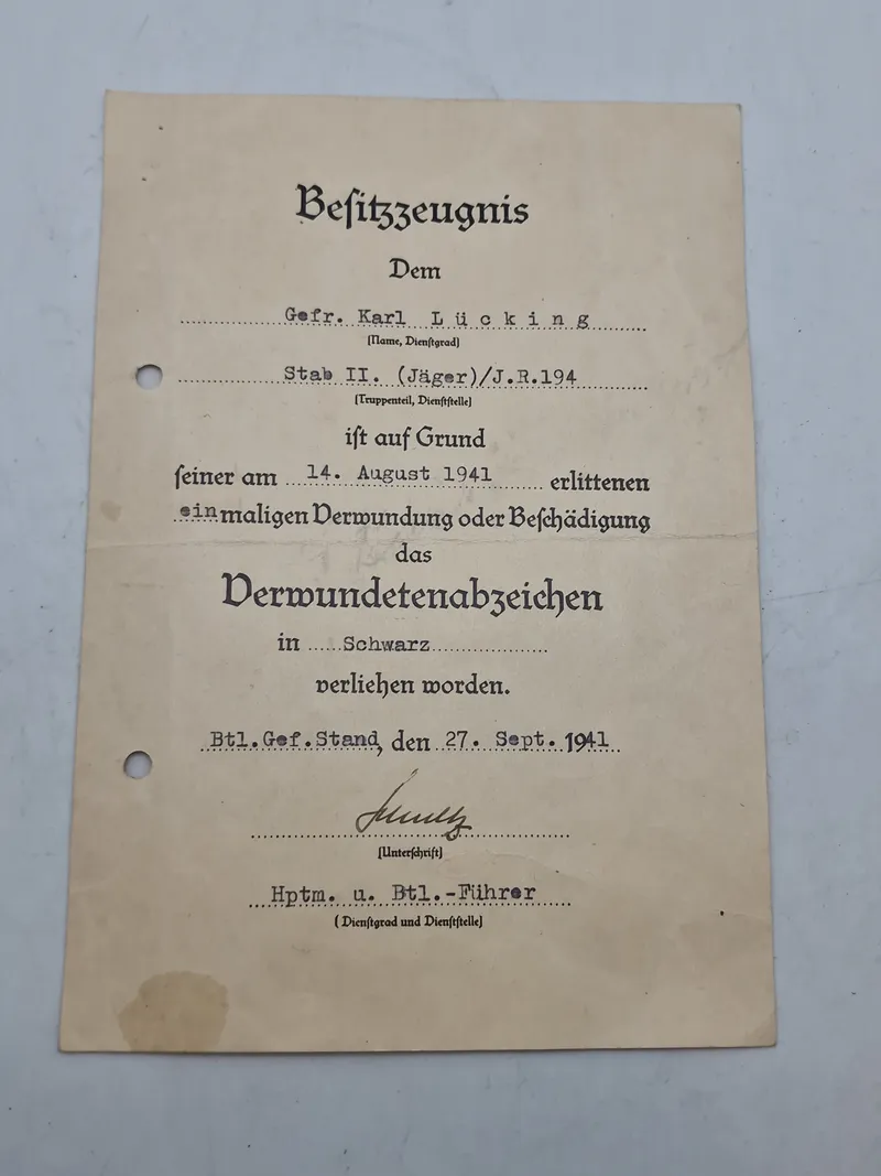 Originalt urkunde - verwundetenabzeichen in schwarz, ww2