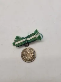 Original fortjenstmedalje (stor og miniature) sølv  fra det danske politi - givet til kvinde