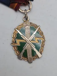 Orignal bl.a. medalje fra føringsstøtteelementet