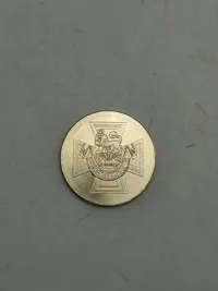 Engelsk mønt med motiv af The Victoria Cross