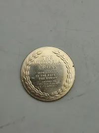 Engelsk mønt med motiv af The Victoria Cross