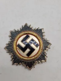 deutsches kreuz in gold (DKiG) lavet hos Rudolf Souval lige efter krigen. Fremstillet på originale maskiner, og delvist originale dele/materialer. Lavet som souvenir til amerikanske tropper