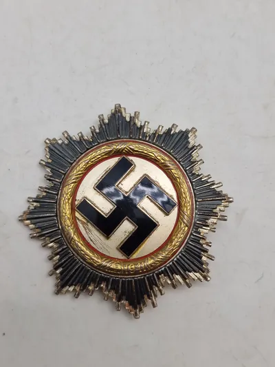 deutsches kreuz in gold (DKiG) lavet hos Rudolf Souval lige efter krigen. Fremstillet på originale maskiner, og delvist originale dele/materialer. Lavet som souvenir til amerikanske tropper