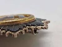 deutsches kreuz in gold (DKiG) lavet hos Rudolf Souval lige efter krigen. Fremstillet på originale maskiner, og delvist originale dele/materialer. Lavet som souvenir til amerikanske tropper