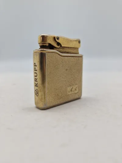 Original lighter med reklame for Krupp