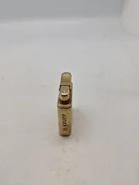 Original lighter med reklame for Krupp