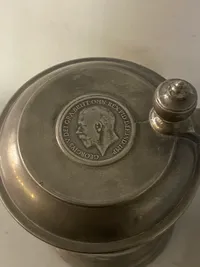 Originalt tinkrus med ilagt engelsk mønt