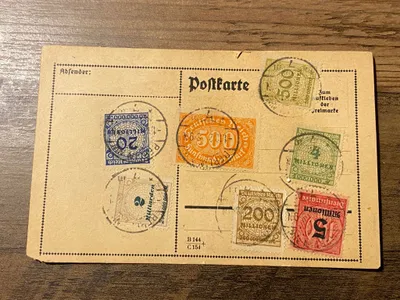 Originalt ww1 postkort med frimærker med høj Mark-værdi
