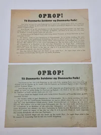 To stk originale Oprop! nedkastet over Danmark 9 april 1940. Bemærk det er de to forskellige udgaver