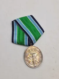 Medalje sterlingsølv 25 års frivillig tjeneste.