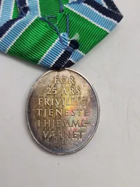 Medalje sterlingsølv 25 års frivillig tjeneste.