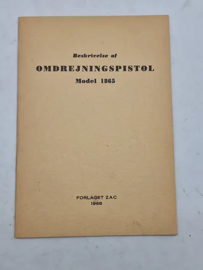 Beskrivelse af
OMDREJNINGSPISTOL
Model 1865