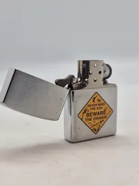 Zippo lighter - Never mind the dog - beware of the owner