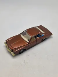 Original Corgi bil med skydende passager på bagsædet