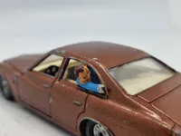 Original Corgi bil med skydende passager på bagsædet