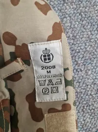 Regnjakke fra det danske forsvar - bemærk patch fra minørtjenesten
