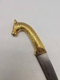 Veludført Indo Persian Mughal horse face dagger, with gold foiel plating and Damascus blade