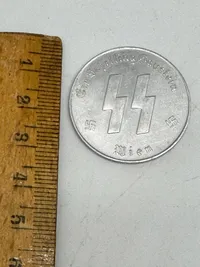 Original SS Token for SS Winter Relief in the amount of 1 Schilling. "MEINE EHRE TREUE HEISST" with SS runes  1 SCHILLING.