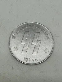 Original SS Token for SS Winter Relief in the amount of 1 Schilling. "MEINE EHRE TREUE HEISST" with SS runes  1 SCHILLING.
