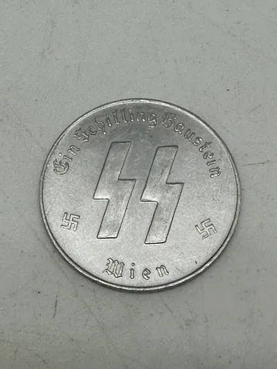Original SS Token for SS Winter Relief in the amount of 1 Schilling. "MEINE EHRE TREUE HEISST" with SS runes  1 SCHILLING.