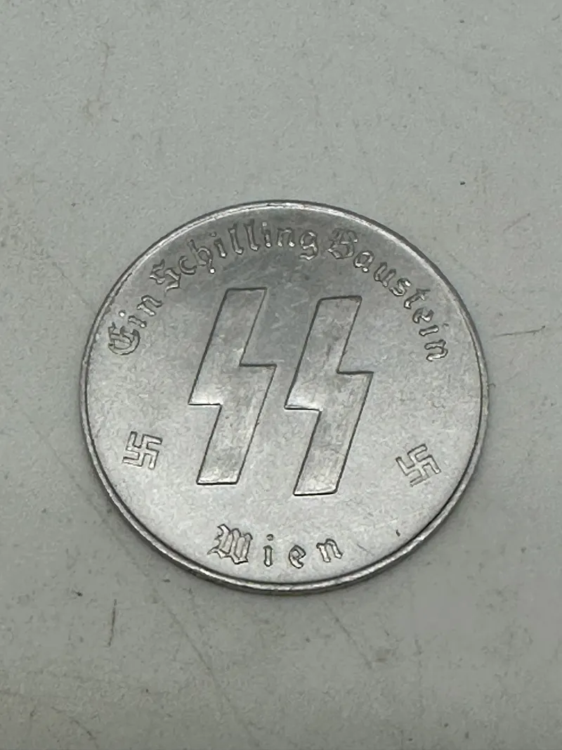 Original SS Token for SS Winter Relief in the amount of 1 Schilling. "MEINE EHRE TREUE HEISST" with SS runes  1 SCHILLING.