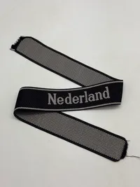 Original  Waffen-SS "Nederland" EM/NCO cuff title-Machine-woven (Bevo). EM/NCO type. Worn by members of the 23. SS-Freiwilligen-Panzergrenadier-Division „Nederland“ (niederländische Nr. 1)