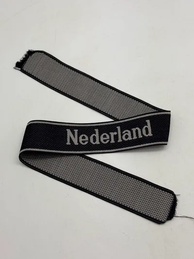 Original  Waffen-SS "Nederland" EM/NCO cuff title-Machine-woven (Bevo). EM/NCO type. Worn by members of the 23. SS-Freiwilligen-Panzergrenadier-Division „Nederland“ (niederländische Nr. 1)