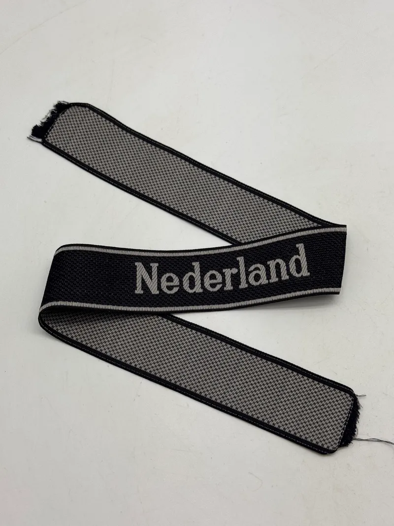 Original  Waffen-SS "Nederland" EM/NCO cuff title-Machine-woven (Bevo). EM/NCO type. Worn by members of the 23. SS-Freiwilligen-Panzergrenadier-Division „Nederland“ (niederländische Nr. 1)