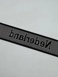 Original  Waffen-SS "Nederland" EM/NCO cuff title-Machine-woven (Bevo). EM/NCO type. Worn by members of the 23. SS-Freiwilligen-Panzergrenadier-Division „Nederland“ (niederländische Nr. 1)