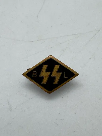 Original SS. A Flemish SS Supporting Member’s Pin,double Sig runes flanked by initials “BL” for Begunstigende Ledenspeld
