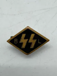 Original SS. A Flemish SS Supporting Member’s Pin,double Sig runes flanked by initials “BL” for Begunstigende Ledenspeld