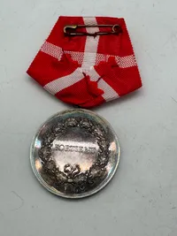 Fortjenstmedaljen i sølv Tildelt : Knud Elvin Knudsen, vægt 43 gram