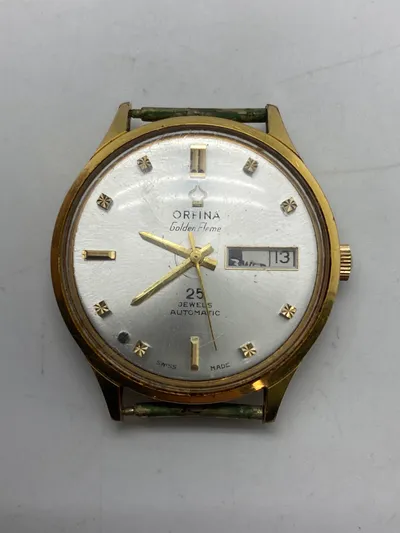 Orfima Automatic Golden flame ur - ure som dette går for mellem 3000-5000,- på EBay