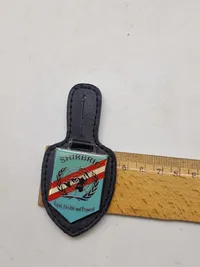 Originale lommeskjolde til uniformen