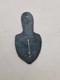 Originale lommeskjolde til uniformen