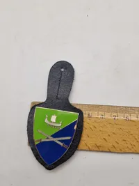 Originale lommeskjolde til uniformen