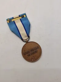 Samling diverse militære medaljer, vinger mm.