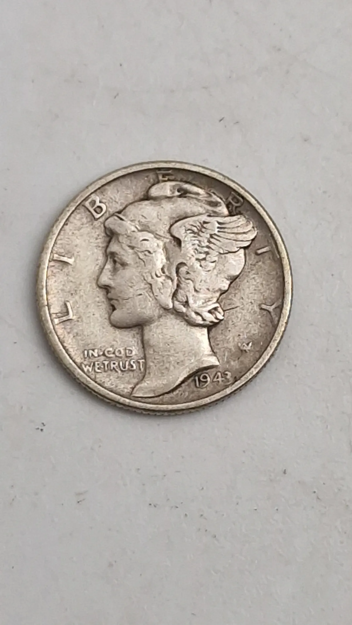 Original 1943 Mercury Dime, også kendt som en Winged Liberty Head Dime, sølv