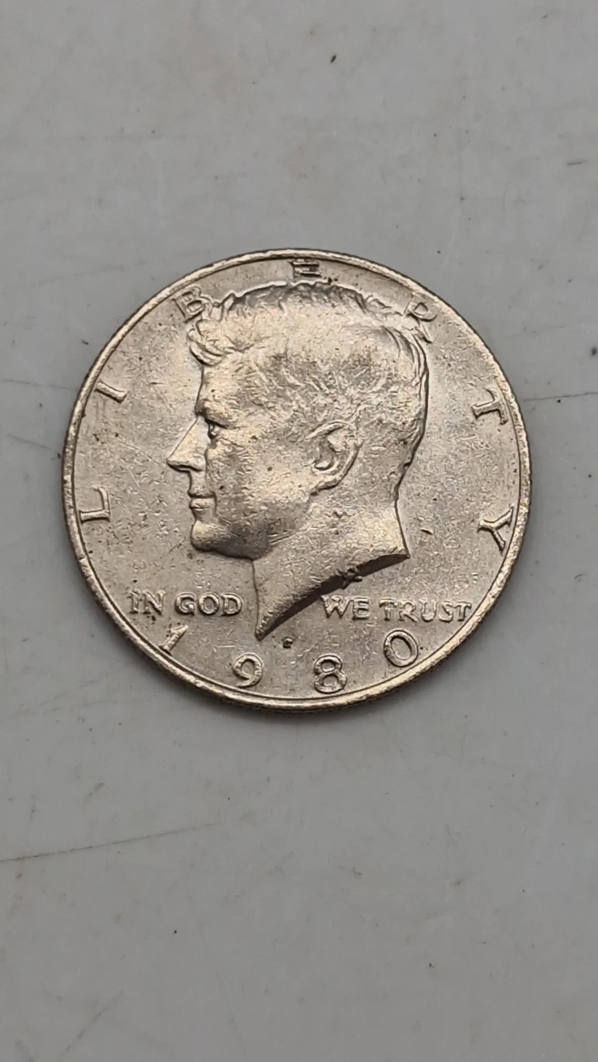 Original Kennedy Half Dollar, en halvdollar-mønt udstedt af United States Mint