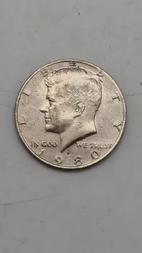 Original Kennedy Half Dollar, en halvdollar-mønt udstedt af United States Mint