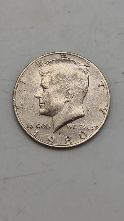 Original Kennedy Half Dollar, en halvdollar-mønt udstedt af United States Mint