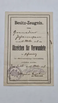 Originalt Dokument "Besitz-Zeugnis" (ejerbevis) for en Grenadier Johansen, dateret 15. oktober 1918. Det bekræfter, at Johansen er blevet tildelt "Abzeichen für Verwundete"
