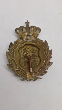 Originalt M/23 hjelmmærke